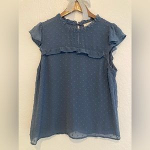 Light Blue short sleeve blouse with clasp in back .